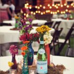 table settings bohemian eclectic | Utah floral arrangement barn colored bottles | Girlfriend is Better