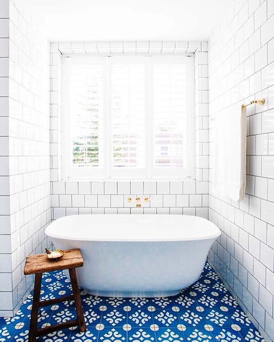 Bright blue bathroom tiles perk up a floor | Girlfriend is Better