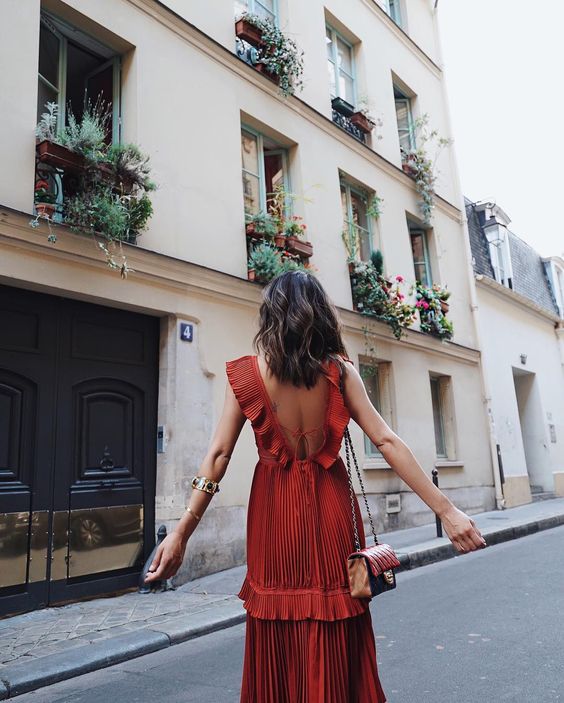 Red ruffles on red dress perfect for travel | Girlfriend is Better