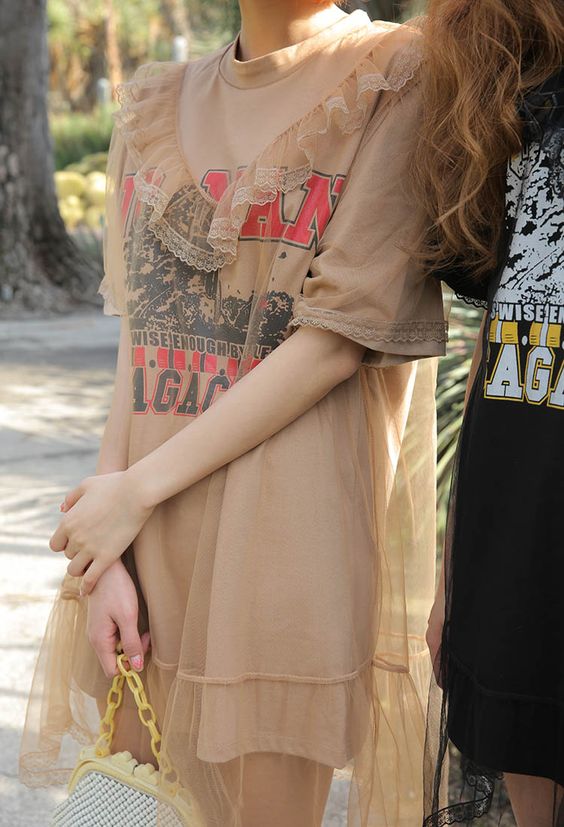 Pair over-sized graphic tees with sheer dresses | Girlfriend is Better