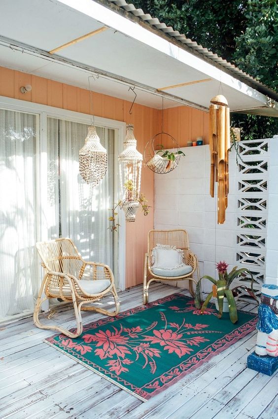 Surf shack patio with shell chandeliers and bamboo wind chimes | Girlfriend is Better