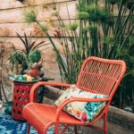 Bamboo chair in bright orange on summer patio | Girlfriend is Better