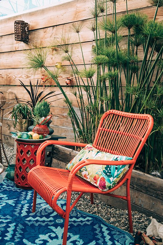 Bamboo chair in bright orange on summer patio | Girlfriend is Better