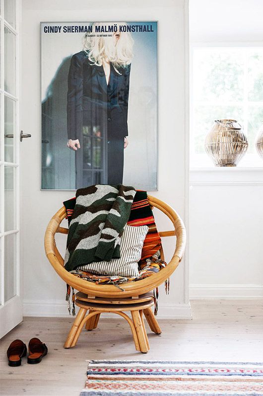 Round bamboo chair in a bright entryway | Girlfriend is Better