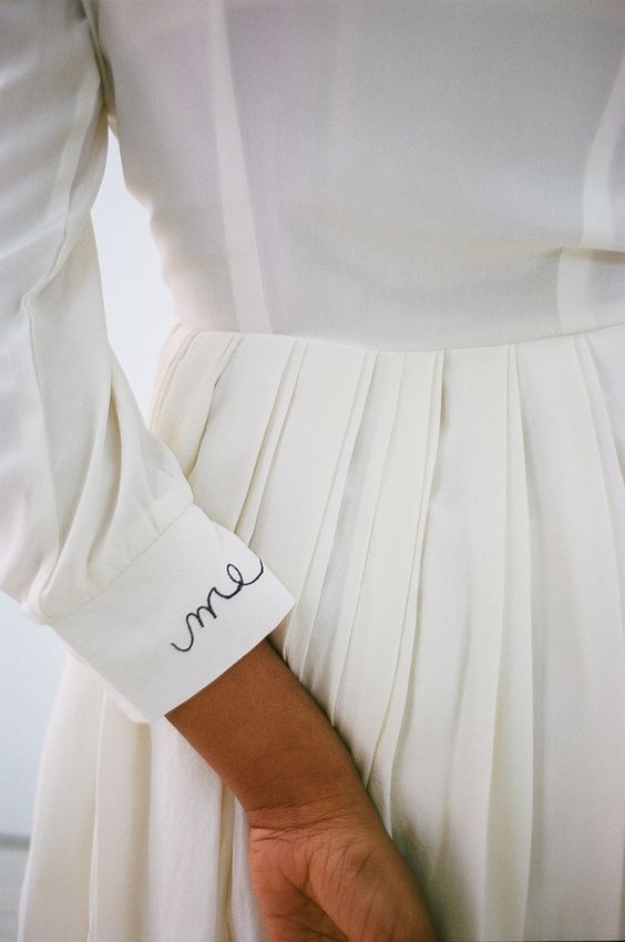 Me embroidered lettering on sleeve cuff of all-white dress | Girlfriend is better