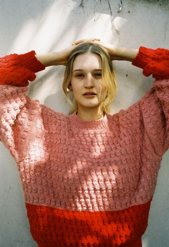 Block shades of orange in cable knit sweater | Girlfriend is Better