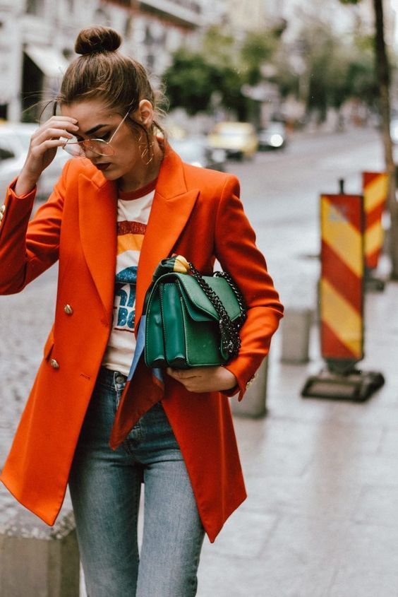 Orange pea coat with green bag and graphic rainbow tee | Girlfriend is Better