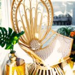 Peacock chair in sun room nook gold accent decor | Girlfriend is Better