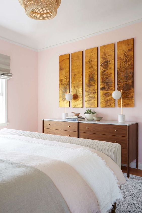 Leo astrology home decor guide | pink bedroom mid-century modern dresser gold wall art panels | Girlfriend is Better