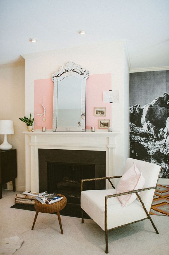 Leo astrology home decor guide | Mid-century modern living room fireplace arm chair mirror pink oversized art photography| Girlfriend is Better