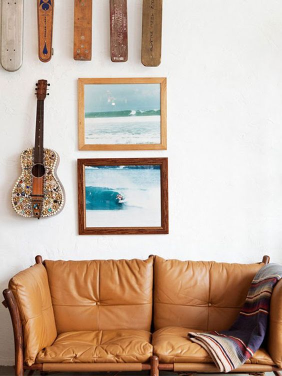 wood element Feng Shui | Bohemian tan leather sofa surf gallery wall frames | Girlfriend is Better