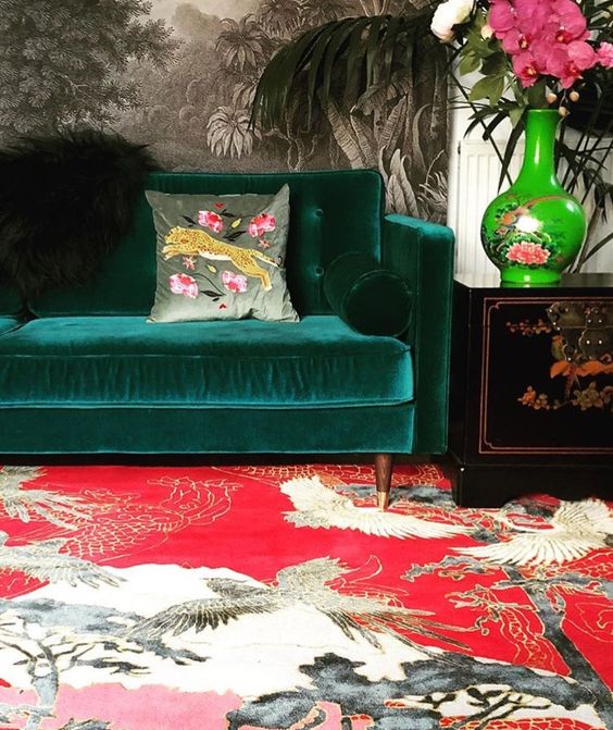 jungle decor red Asian rug green velvet sofa | Girlfriend is Better