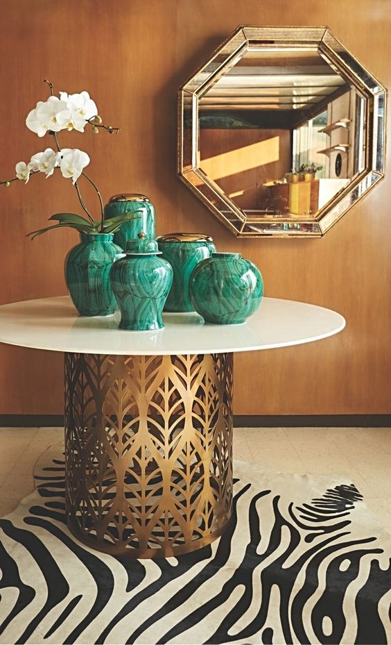 chinoiserie malachite vases | laser-cut brass metal dining table zebra area rug | Girlfriend is Better