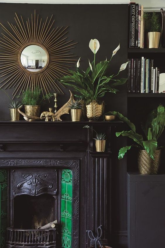 metal element Feng Shui | mid-century modern gold vases plant pottery starburst mirror black fireplace | Girlfriend is Better