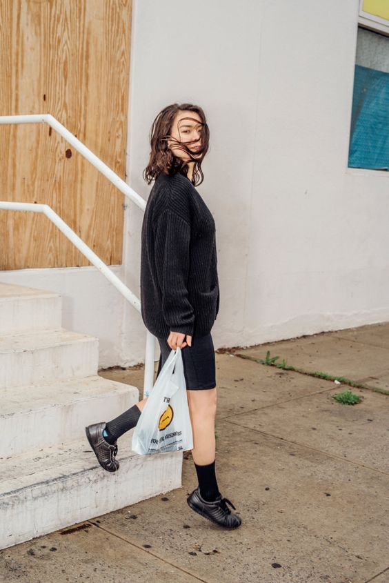 Mitski | Mitski walking down stairs holding plastic bag | Girlfriend is Better