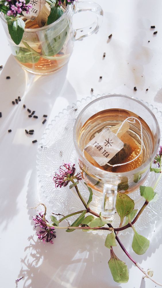 Afternoon Tea | flowers in filled teacup on wood slab | Girlfriend is Better