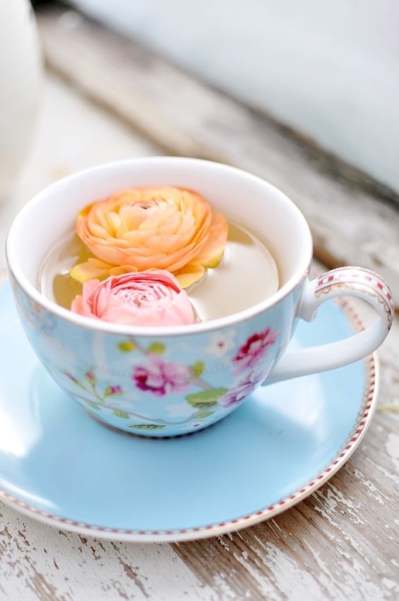 Afternoon Tea | flowers in filled teacup on wood slab | Girlfriend is Better