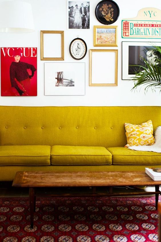 Gold Sofas | mid-century modern yellow couch gallery wall red area rug | Girlfriend is Better