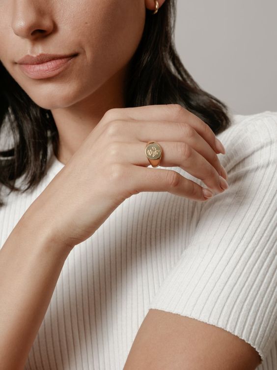 gold signet ring | woman displaying hand | Girlfriend Is Better