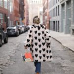 Valentine's Day street style outfits | heart faux fur coat sett through purse | Girlfriend is Better