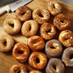 bagel sandwich | baked bread scattered on a table | Girlfriend is Better