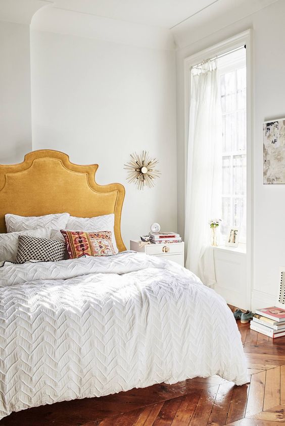 midsummer hygge bedroom decor | gold headboard white bedding sunburst mirror books | Girlfriend is Better