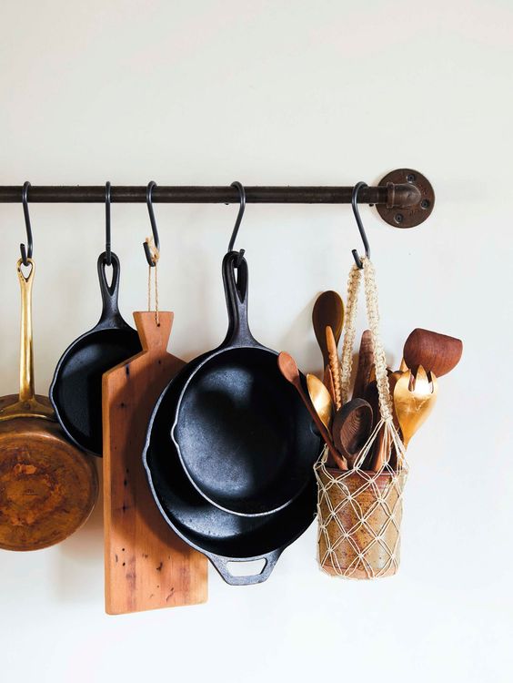 midsummer hygge | pot rack cheeseboard cutting board skillets macrame wood spoons | Girlfriend is Better