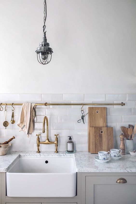 kitchen utility hooks | vintage brass fixtures hanging rod cleaning sink | Girlfriend is Better