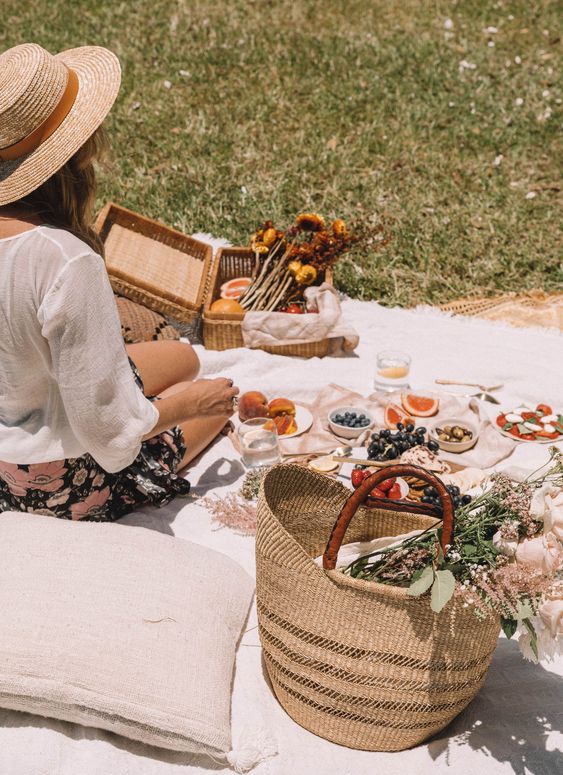 Spring picnic | straw basket fruit blanket pillow wildflowers hygge | Girlfriend is Better