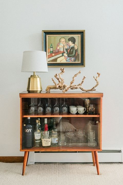 bar cart styling | mid-century modern cabinet liquor painting crystal glassware china tea cups | Girlfriend is Better