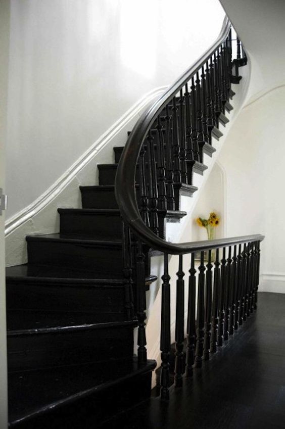 black floors | curved staircase bannister wood flooring stair risers | Girlfriend is Better