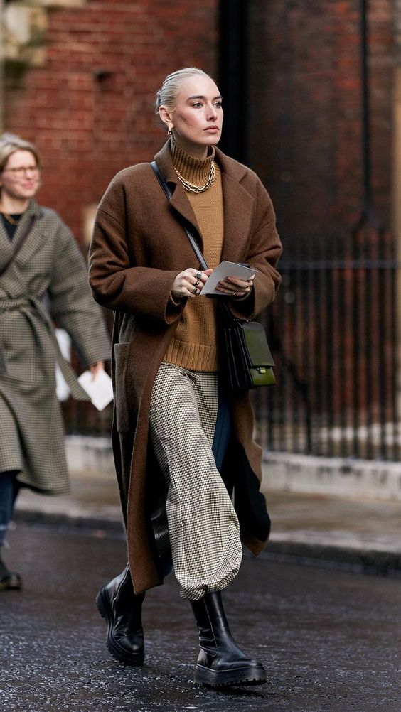 chunky black boots | combat stomping tucked in slacks full-length coat turtleneck sweater neutrals | Girlfriend is Better